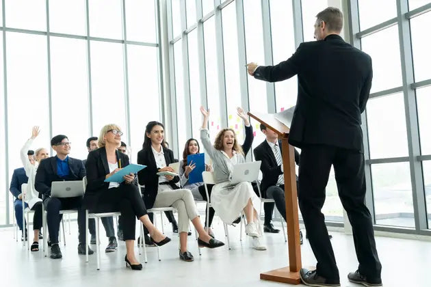 an individual presenting in front of a group