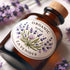 Organic handmade lavender oil bottle with a floral label, surrounded by fresh lavender flowers on a soft background.