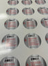 Sheet of round GalacticMoss barcode labels with safety warnings printed on metallic silver background.
