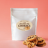 Chocolate chip cookies neatly packaged in a clear bag, showcasing their golden-brown color and tempting chocolate chips.