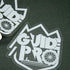 Clear vinyl stickers featuring the bold "GUIDE PRO" logo with mountain outlines and a bike wheel, placed on a dark surface.